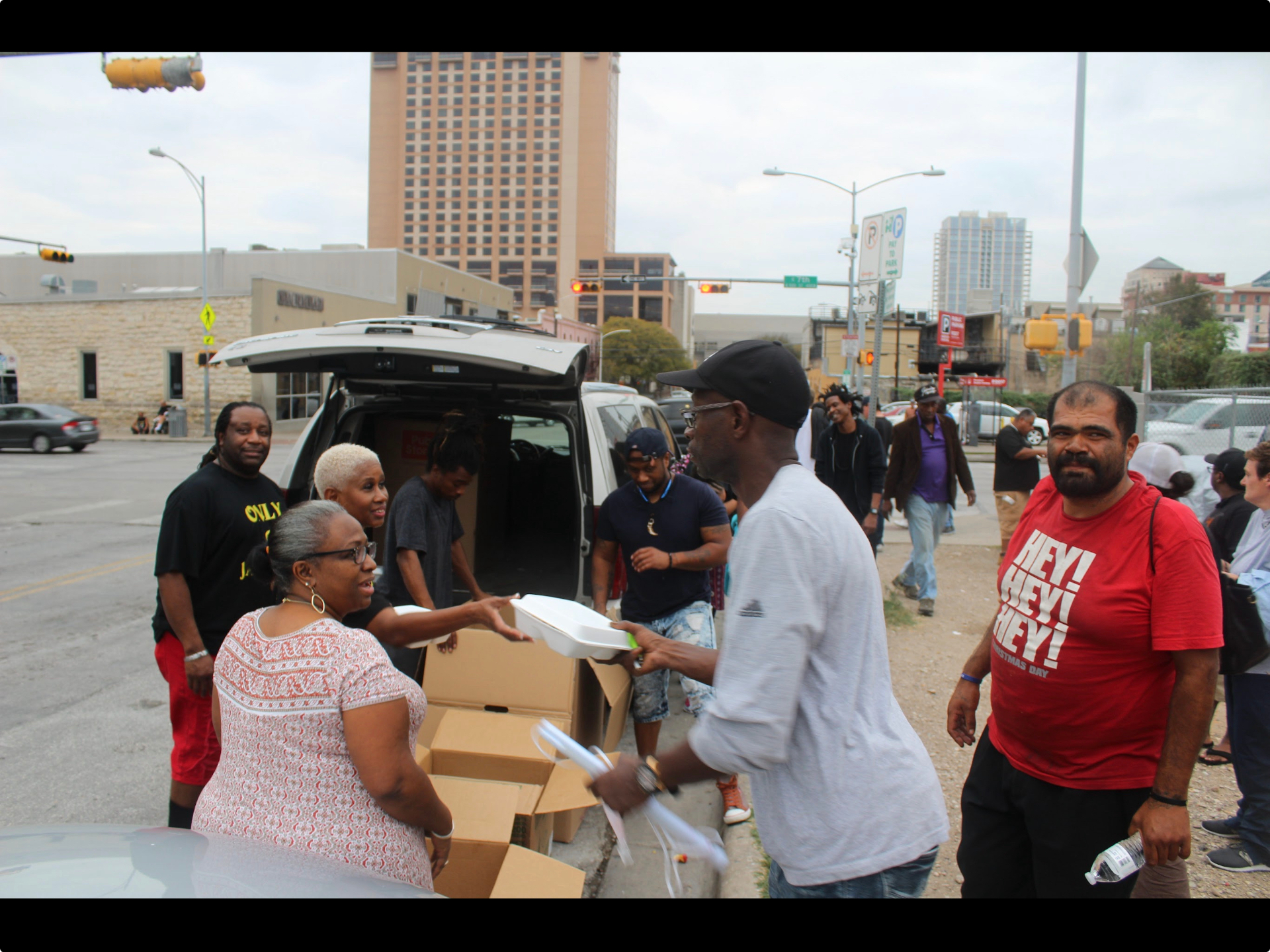 STEPS volunteers serving meals to community members in Austin